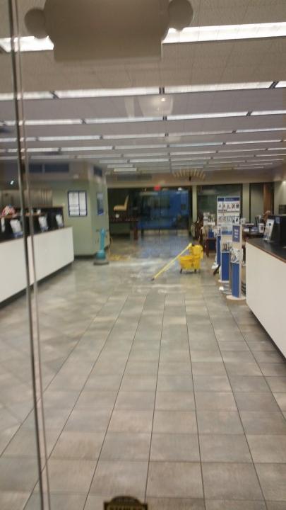 BCG Management janitor in Metairie, LA mopping floor.